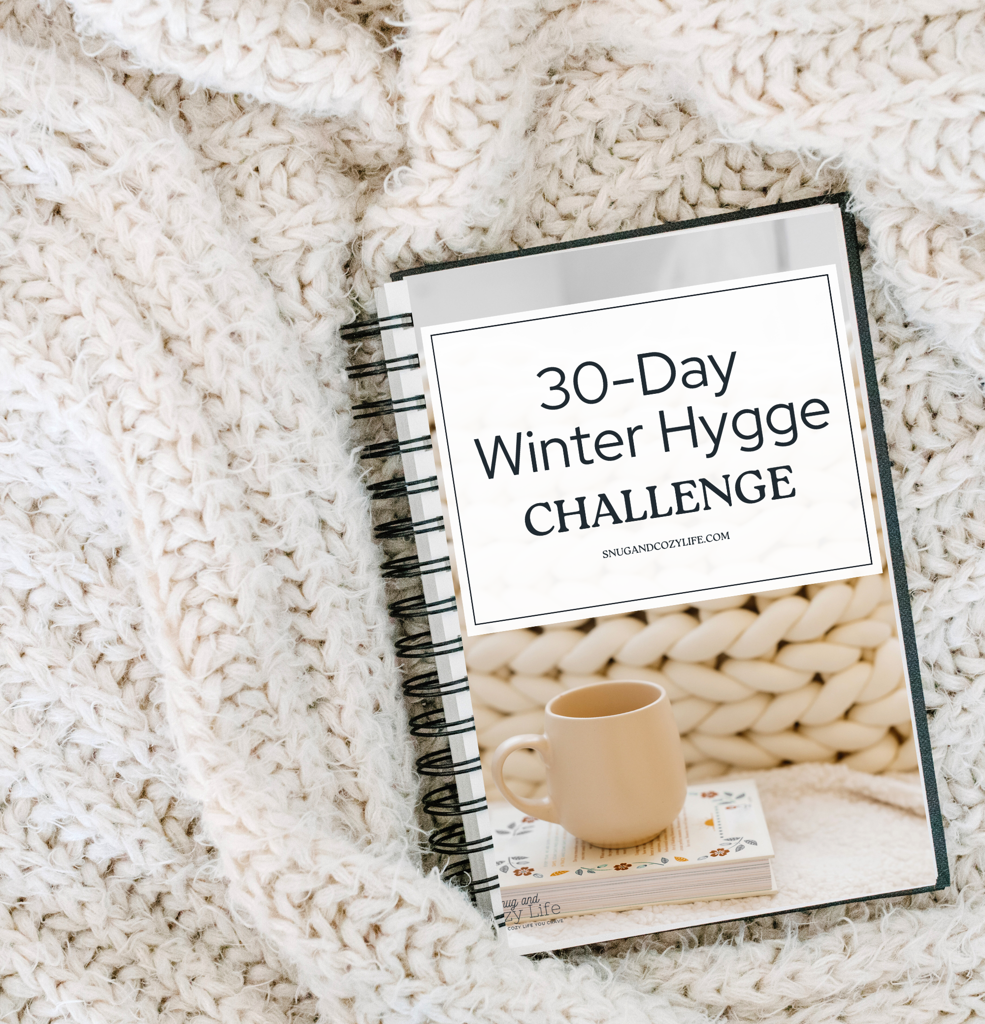 This is a mockup of the 30-day winter hygge challenge printable guide sitting on a cozy knit blanket.